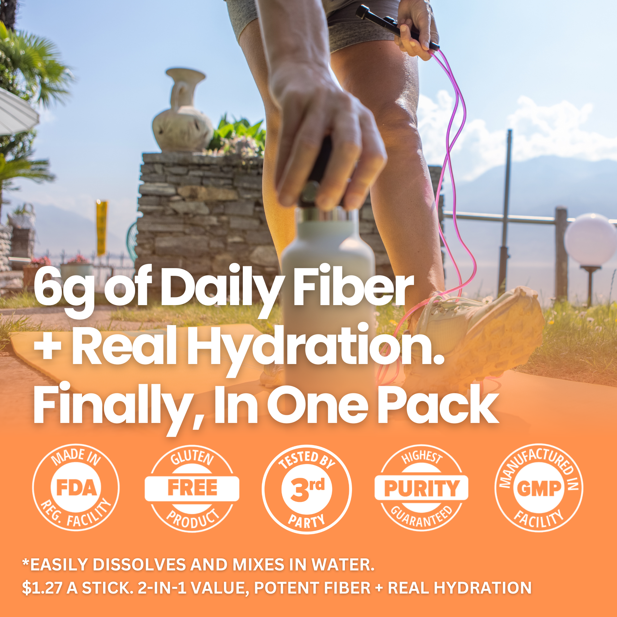 Promotional graphic for a fiber and hydration stick pack, featuring a close-up of a person holding a white stick pack outdoors on a sunny path. Large white text reads &