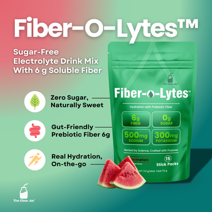 A green stand-up pouch of Fiber-O-Lytes electrolyte drink mix with watermelon slices in front, on a teal-to-pink gradient background. Large white text reads &